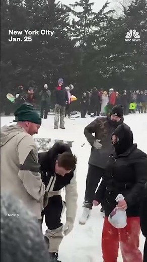 Snowboarder Shaun White performs tricks in Central Park