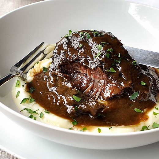 Meltingly tender beef in a rich red wine sauce - you're going to love how easy this one is!! https://www.recipetineats.com/slow-cooker-red-wine-beef-cheeks/ | RecipeTin