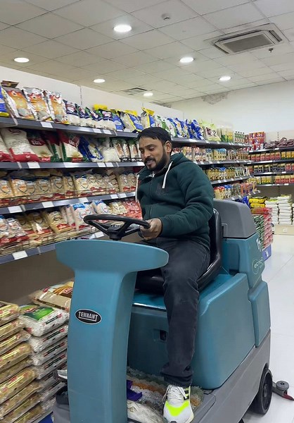Floor Cleaning Machine in Action at Grocery Store
