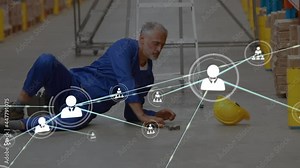 Animation of network of connections with icons over man falling from ladder in warehouse