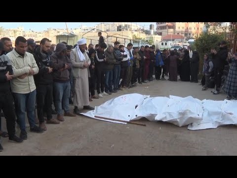 Relatives mourn after at least ten people were killed by Israeli airstrikes in southern Gaza