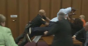 The father of one of three victims of Ohio serial killer Michael Madison leaped over a table to attack the defendant in court Thursday just minutes after the judge pronounced a death sentence in a Cleveland court