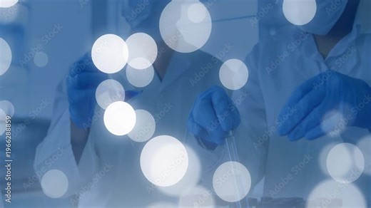 Vertical video: Camera focusing, two gloved white-coated lab techs pipetting at tube rack for tests