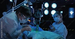 Scientist takes a sample of the material of the alien. There is an autopsy of a humanoid in the laboratory. Stock Video