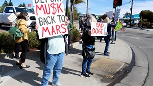 SLO residents protest against Elon Musk outside Tesla Dealership