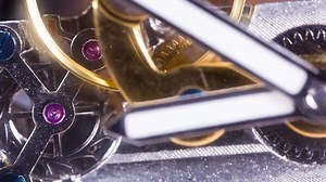 stop motion of a clock watch with lots of gears and cogs