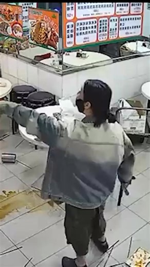 Wild footage shows a furious diner in Hong Kong clashing with more than a dozen armed officers after her phone battery died while trying to pay for a meal via app. | New York Post