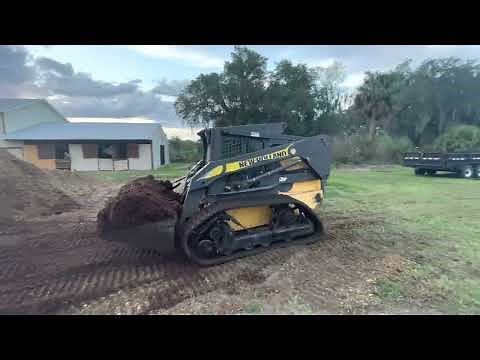 New Holland L-185 wheeled skid steer with Loegering tracks