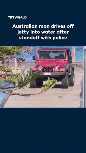 Australian man drives off jetty into water after standoff with police