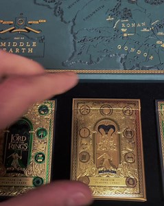 6.5M views · 22K reactions | JUST RELEASED!  The Lord of the Rings Special Edition Box Set makes its arrival from Mordor. The deep green and gold foil box is absolutely breathtaking - and sealed with a magnetic closure.  Officially Licensed by Warner Bros  Includes Exclusive Gold Foil Special Edition Decks  Fast Worldwide Shipping  Handcrafted in the USA | theory11 | Facebook