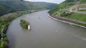 Passenger Ship cruising historic landmarks along river Rhine in Bingen Germany