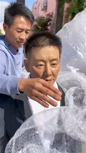 Custom-made wax figure of elderly father for packaging and boxing