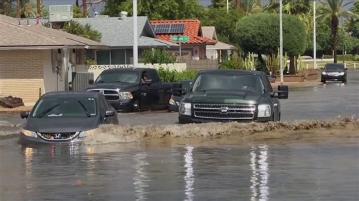 Flood waters across Arizona trap cars, leave families stranded