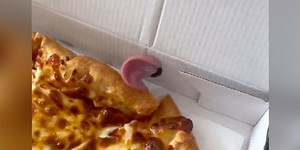 Couple Opens Pizza Box — And Finds The Cutest “Topping” Ever