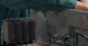 technician disassemble the system unit, block, computer case computer chassis. man changing details of system unit Slow motion