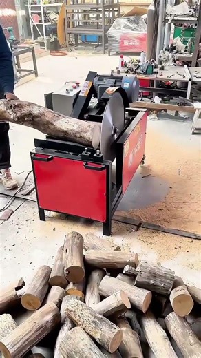 Cutting thick wooden logs into smaller pieces using a high power electric circular saw machine