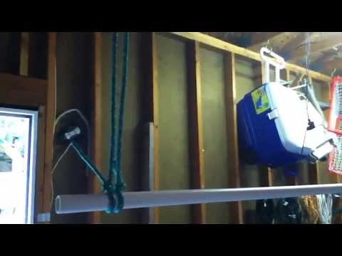 Homemade suspended clothing rack for garage sale