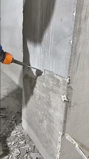 Removing Concrete Wal Tiles Using An Electric Demolition Hammer To Renovate The Interior Of Building