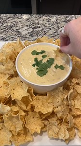 Creamy, Flavor-Packed Queso DipThis queso is ultra-creamy, loaded with just the right amount of spice, and features the rich, roasted flavor of green chilies. For the best results, be sure to use high-quality cheese—get it from the deli rather than prepackaged, as it melts smoother and adds a richer taste. The blend of white American and pepper jack cheeses brings a smooth, melty texture with a hint of heat. Pro tip: Make it ahead of time and reheat when you’re ready to serve—the flavors only ge