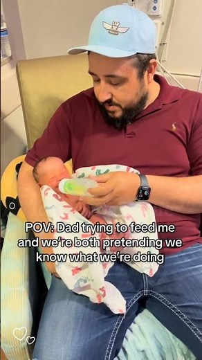 Dad trying to feed me and we're both pretending we know what we're doing