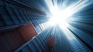 clip-1049319934-three-courtyard-elevator-cabins-traveling-upwards-on