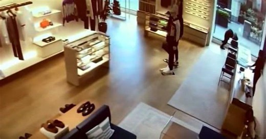 Caught on camera: Thief knocks himself out against window while trying to run away with stolen goods