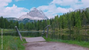 italian alps dolomites national park lake mountain trekking peaks tre cime brais lake carezza lake reflection clouds
