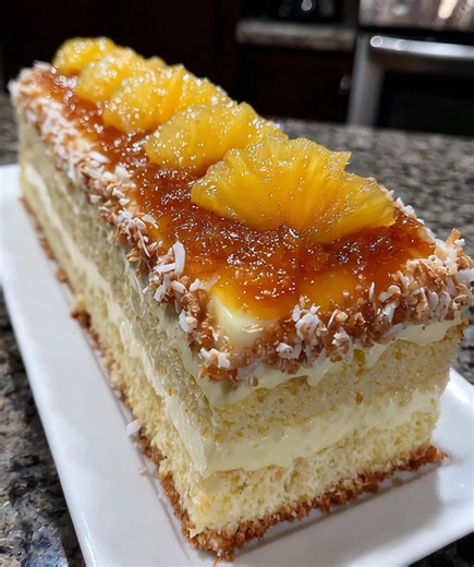 Pineapple Papaya Dream Layer Cake Ingredients: - 2 cups all-purpose flour - 1 ½ cups granulated sugar - ½ cup unsalted butter, softened - 1 cup buttermilk - 3 large eggs - 2 teaspoons baking powder - 1 teaspoon baking soda - ½ teaspoon salt - 1 teaspoon vanilla extract - 1 cup crushed pineapple, drained - 1 cup ripe papaya, diced - 1 cup shredded coconut (optional) - Cream cheese frosting (store-bought or homemade) Instructions: 1. Preheat your oven to 350°F (175°C). Grease and flour three 9-inc