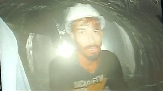 How did the 41 workers trapped inside a collapsed Himalayan highway tunnel survive for almost two weeks?