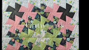 20 reactions | A simple quilt that makes quite the statement! Simple piecing and beautiful feathered quilting come together in a stunning design called, "Cartwheel". | HoopSisters | Facebook
