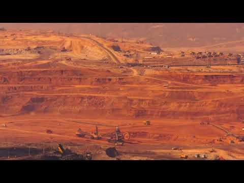 Time lapse video of open pit mining equipment at work