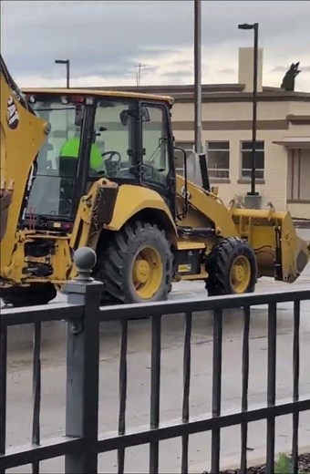 BACKHOE LOADER, used for landscaping, including digging trenches, excavating foundations, & loading.