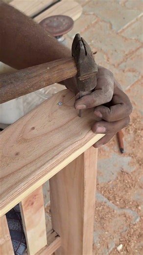 Nail install in Wood with the help of Hammer