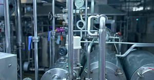 Close look at the pipelines with valves and barometer.