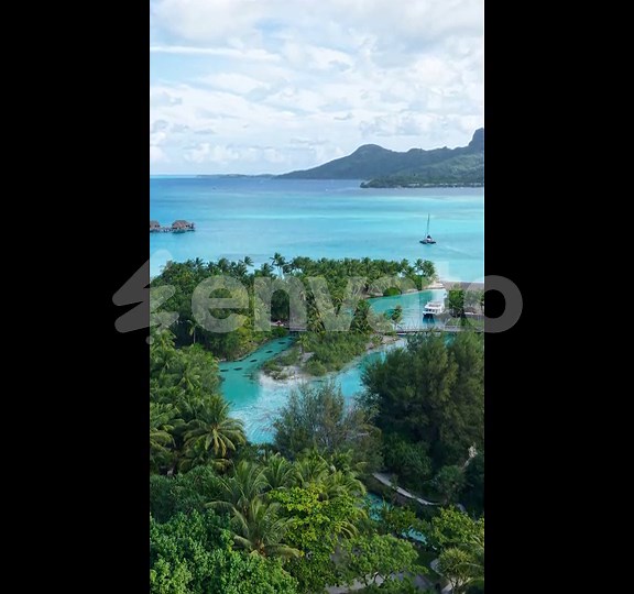 Bora Bora Island, French Polynesia. Establishing Vertical Drone Shot of Lagoon and Luxury Resort