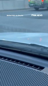 WILD RIDE: Two women scream in disbelief as a rat climbs out of their car hood on a busy New York City road. | Fox News
