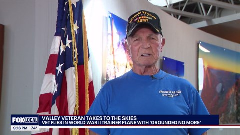 Veteran flies in WWII trainer plane with 'Grounded No More'