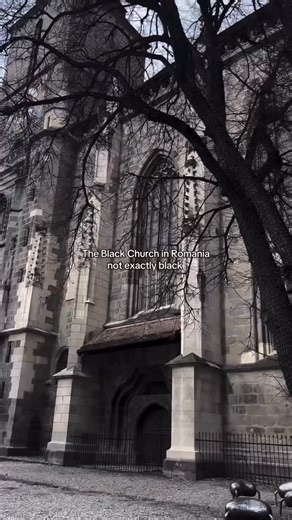 Romania on Instagram: "Do stones remember fire? The Black Church stands in Brașov like a reprimand written in basalt prose, a cathedral that feels less like a sanctuary and more like a verdict. Gothic ribs claw upward, austere and unadorned, as if beauty here was rationed. Raised by Transylvanian Saxons who believed in discipline, trade, and God—in that order—it feels oddly Nordic for Romania, a transplanted northern spine lodged in the Carpathians, refusing assimilation. Its blackened skin is n