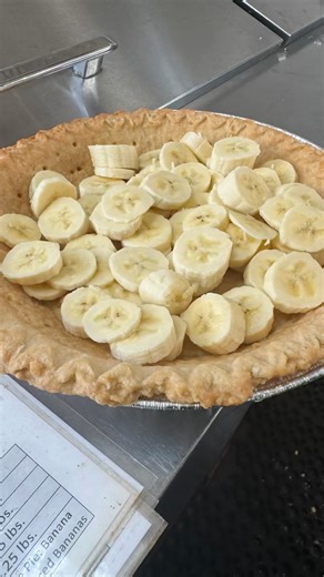We slice every banana by hand for each pie to keep everything as fresh as possible. It takes a little more time, but we think it's worth it. Can you guess how many bananas go into a single pie? | Yoder's of Pinecraft