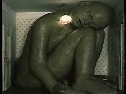 A human body gradually reconstructs itself as its various component parts crowd themselves into a small room and eventually, after much experimentation, sort out which part goes where. | Macabre Art