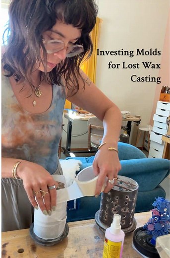 Here is a little video on the investment process for lost wax casting. It is a very important part of the process since this is the part where we are essentially making a mold of the jewelry. First wax is injected into our molds. Rings are sized, waxes are cleaned up and attached to a middle spruce like a tree trunk. This is why they’re called wax trees. After that, I put a perforated steel flask around the wax trees and tape it up. Each flask sizes requires a different amount of powdered invest