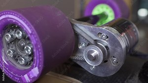 Longboard electric motor wheel and gears assembling, carbon board, extreme technology Stock Video