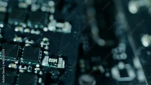 Microchip close-up. Microcircuit filming from right to left and a blurred background in close-up. Technological innovation and progress. Advancement of technology.