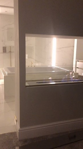 Cozy Modern Bathroom with Unique Fire Feature