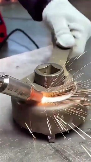 Welding industrial metal components using a laser to join parts together strongly and neatly