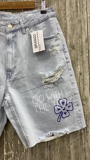 Light Blue Denim Shorts with Unique Graphics and Patches