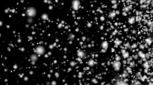 Loop blurred white dust particles animation on black background
