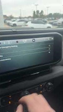 How to turn on forward collision warning with automatic emergency braking in a Jeep