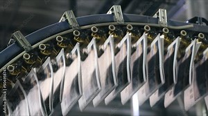 A media source pages printed out of the etched image on aluminum plates. Close-up view of the operating industrial newspaper printer. High quality FullHD footage