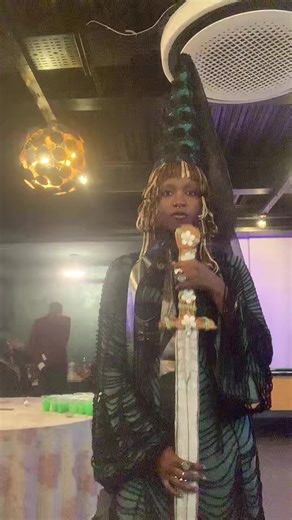 dressed up as a medieval princess with a ceremonial sword for knighting people #medieval #princess #halloweencostume #hennin #fyp